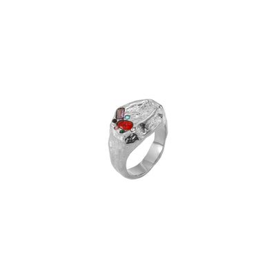 Anillo tipo sello de acero inoxidable plateado y circonitas de colores de distintas medidas
